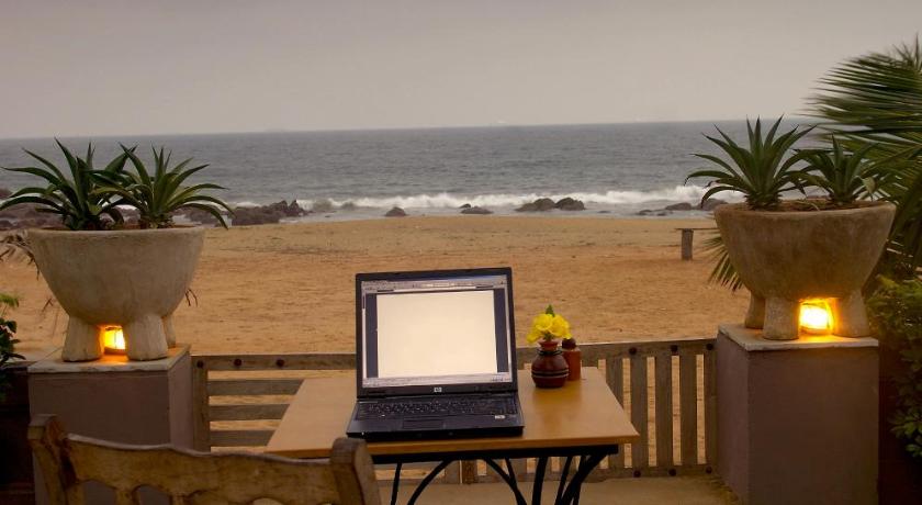 a laptop computer sitting on top of a wooden table, The Park Hotel Visakhapatnam in Visakhapatnam