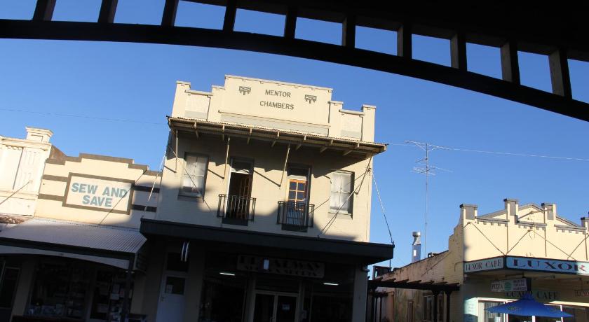 a large building with a clock on it, Mentor Chambers Apartment Bed & Breakfast in West Wyalong