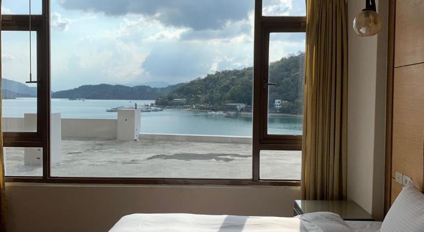 a hotel room with a view of the ocean, Miracolo View Hotel in Nantou