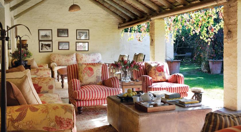 a living room filled with furniture and a couch, Elephant House in Addo