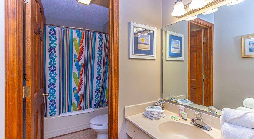 a bathroom with a bathtub, toilet, sink and mirror, Plantation Golf Villas 2 Miles to the beach! Sleeps 6 in Myrtle Beach (SC)