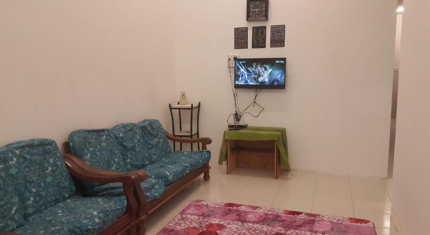 a living room filled with furniture and a tv, HOMESTAY EIJAZ KUALA  ROMPIN in Kuala Rompin