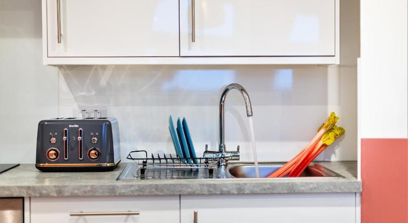a kitchen counter with a sink and a microwave, Your Apartment I Clifton Village in Bristol