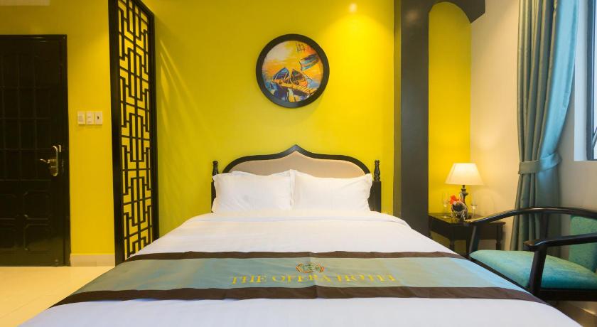 a bedroom with a large bed and a large mirror, The Opera Hotel in Haiphong