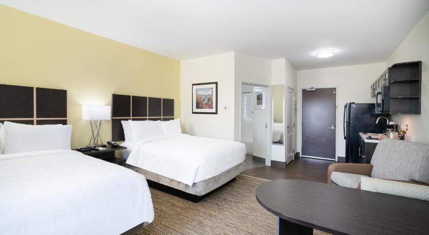 a hotel room with two beds and a television, Candlewood Suites Nashville - Franklin in Franklin (TN)