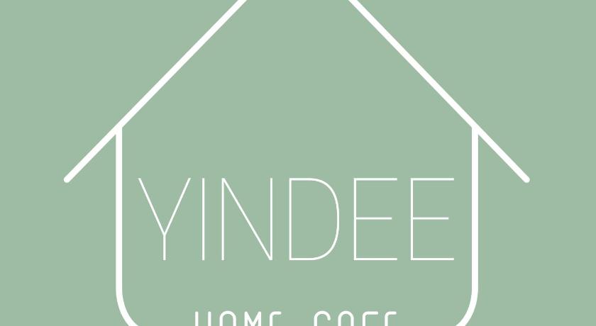 a sign with a picture of a person on it, Yindee Home and Cafe in Nan
