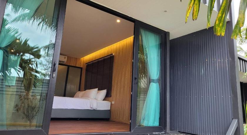 a room with a bed and a window, Sunnyvale Ranong 2 in Ranong