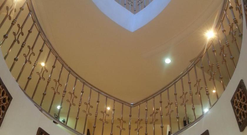 a large room with a large clock on the ceiling, Dorar Darea Hotel Apartments - Al Malqa in Riyadh