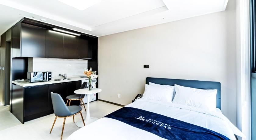a hotel room with a bed and a desk, Hi Ocean Gyeongpo in Gangneung-si