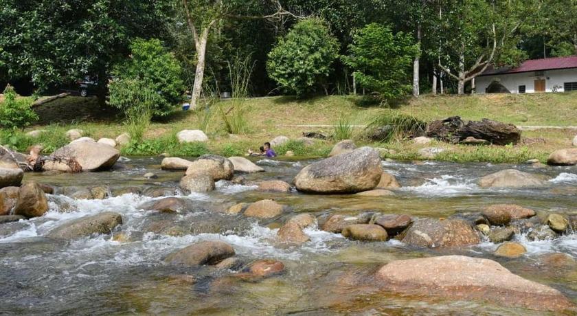 a river that has a bunch of rocks in it, Lubok Jong Riverside, Sedim in Karangan