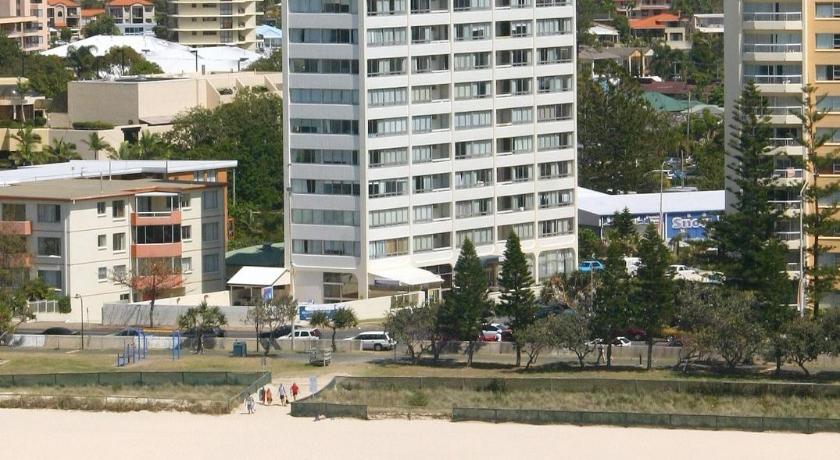 a beach with a large body of water, The Shore Beachfront Apartments in Gold Coast