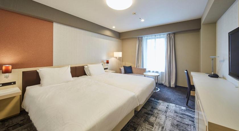 a hotel room with two beds and a large window, Richmond Hotel Narita in Narita