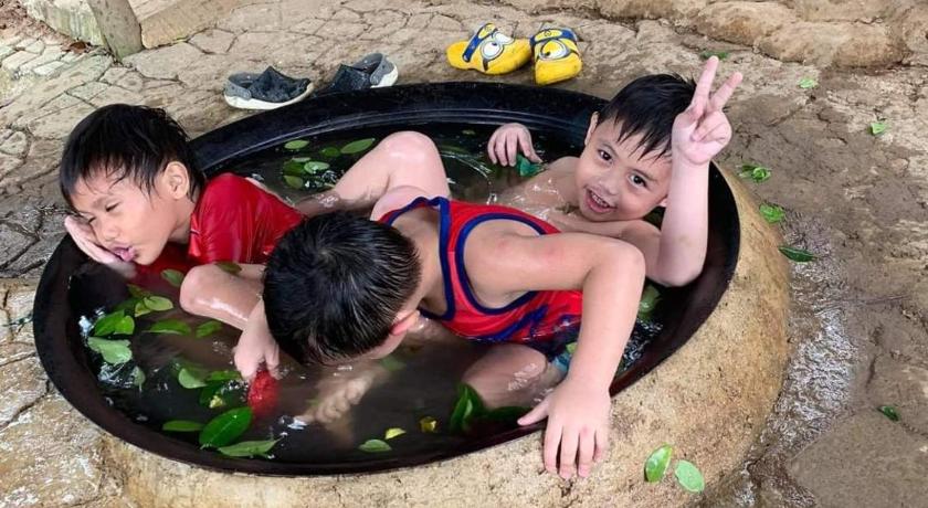 two children are sitting in a pool of water, Singalong Salceda's Mountain View Kawa Bath and Garden Camp Tent Adventure in Antipolo