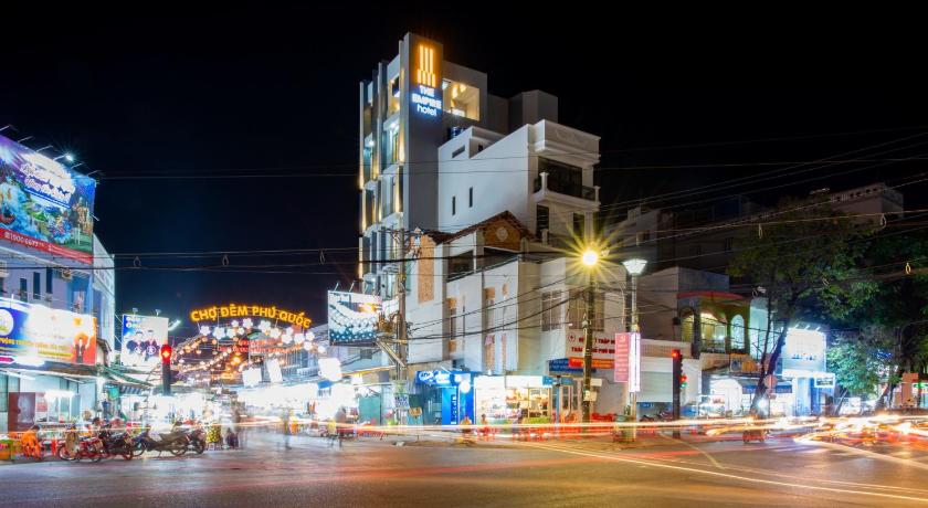 a city street filled with lots of traffic at night, The Empire Hotel in Phu Quoc Island