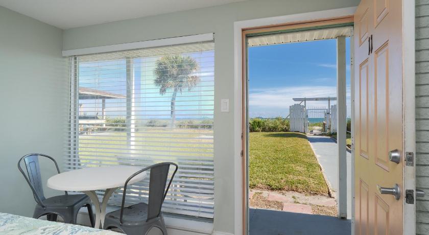 a bedroom with a view of the ocean, Sea Aire Oceanfront Inn in Cocoa Beach (FL)