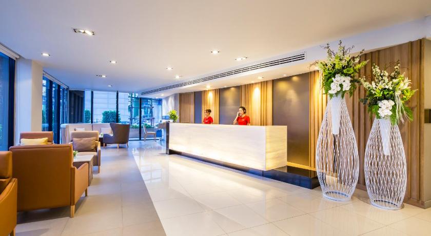 a living room filled with furniture and a large window, Pacific Park Hotel (SHA Extra Plus) in Chonburi
