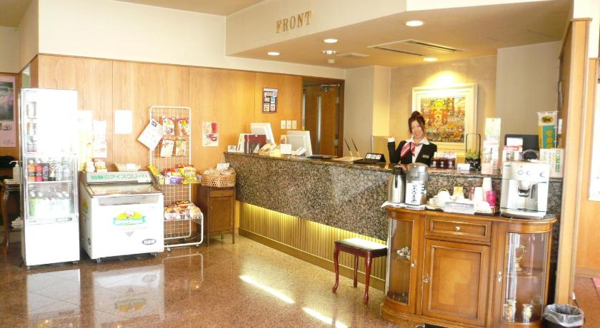 a kitchen with a large counter top and a large counter top, Takayama City Hotel Four Seasons in Takayama