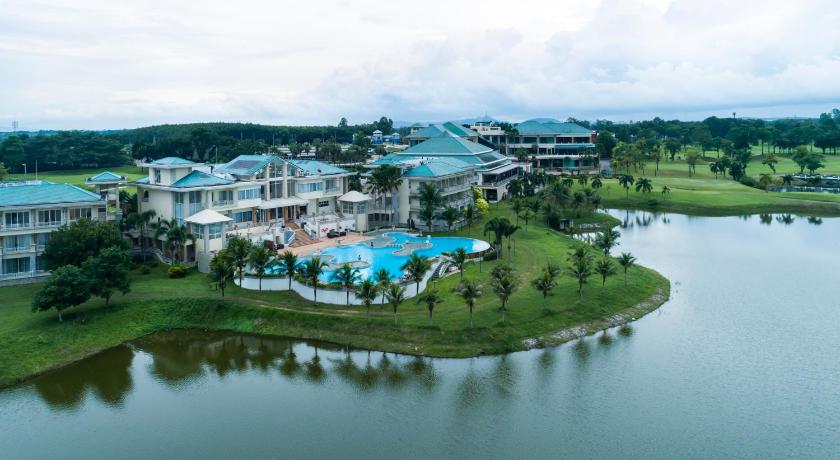 a lake with houses and boats on it, Pattana Sports Resort (SHA Extra Plus) in Chonburi