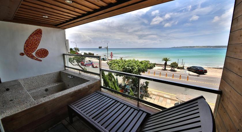 a view from the balcony of a cabin overlooking the ocean, Far Falla Hotel in Kenting