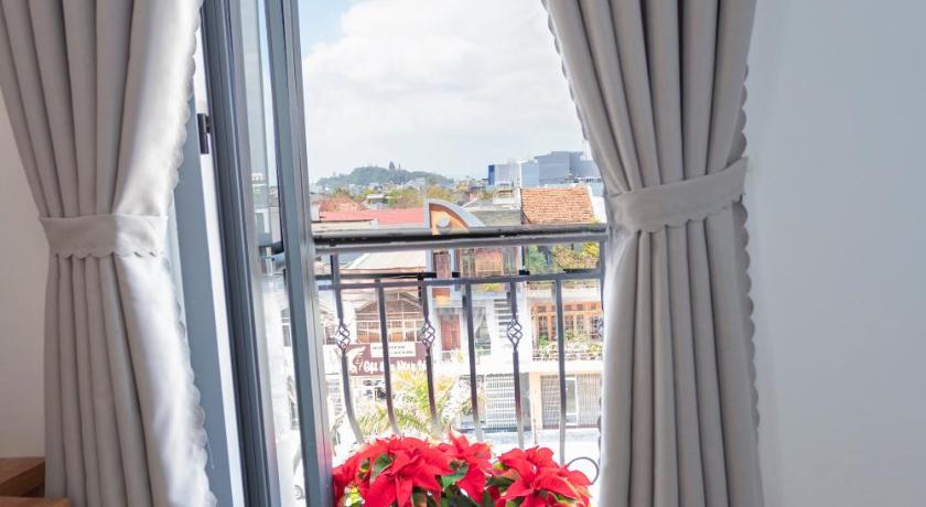 a view through a window into a room with a balcony, Rivera Tuy Hoa Hotel in Tuy Hòa (Phú Yên)