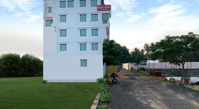 a large building with a white house on the side of it, Hotel Rani and Rani Residency in Pondicherry