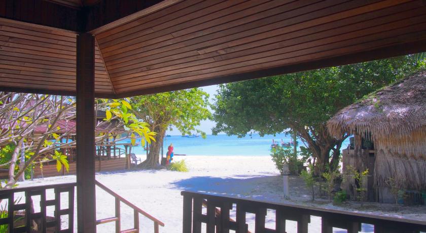 a patio area with a view of the ocean, Chareena Beachside in Ko Lipe