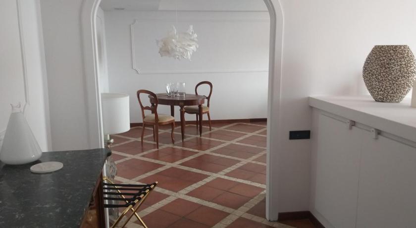 a living room with a table and chairs, Villa Pocci in Castel Gandolfo