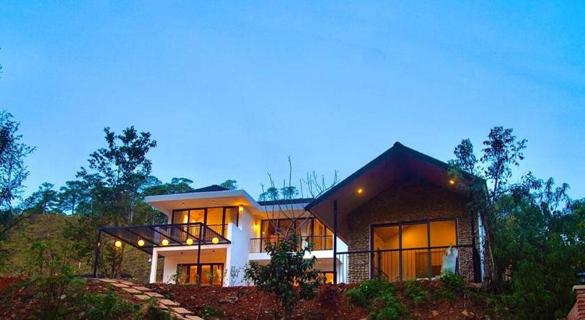 a house with a large window overlooking a forest, Dhalia Stream View Cottage in Dalat