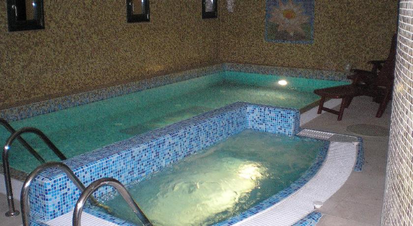 a swimming pool with a blue and white tub, Casa Ninfea Panzio in Cserszegtomaj