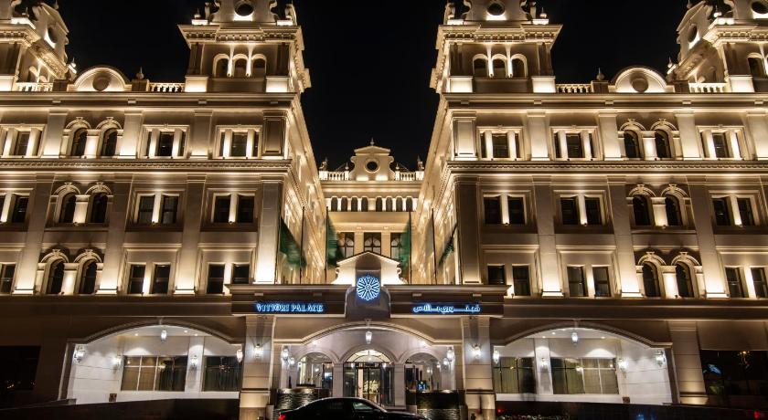 a large building with a clock on the front of it, Vittori Palace Hotel and Residences in Riyadh