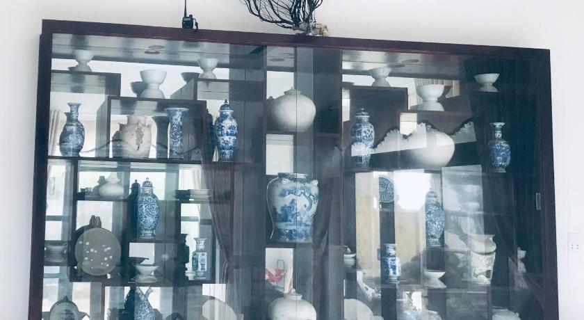 a collection of antique items sitting on top of a shelf, Quang Vinh - Đao Ly Son in Ly Son