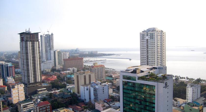 a city with tall buildings and tall buildings, Regency Grand Suites in Manila