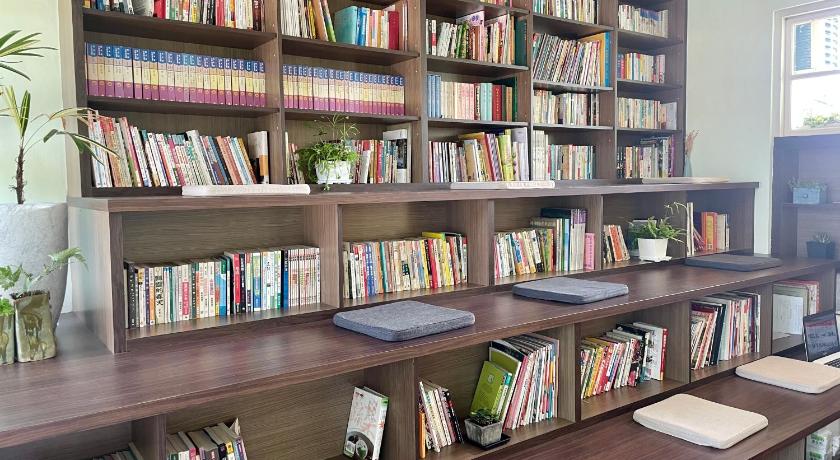 a book shelf filled with books and bookshelves, Little Garden Dream Life Home in Nantou