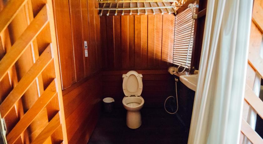 a bathroom with a toilet and a sink, River Kwai Jungle Rafts Resort (SHA Extra Plus) in Kanchanaburi