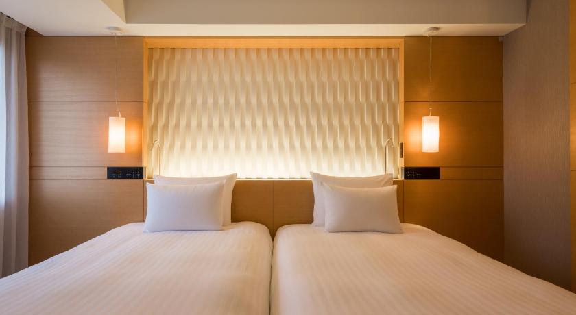 two white beds in a hotel room, Hotel Associa Shizuoka in Shizuoka