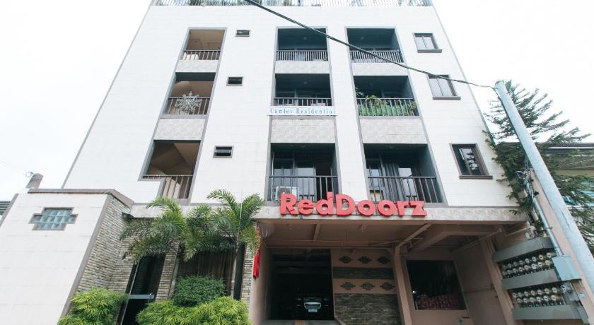 a building with a sign on the front of it, RedDoorz Plus @ Canley Residential in Manila