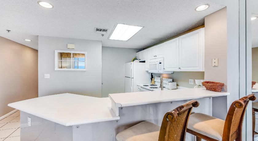 a kitchen with a table, chairs and a refrigerator, Sterling Sands 804 Destin (Condo) in Destin (FL)