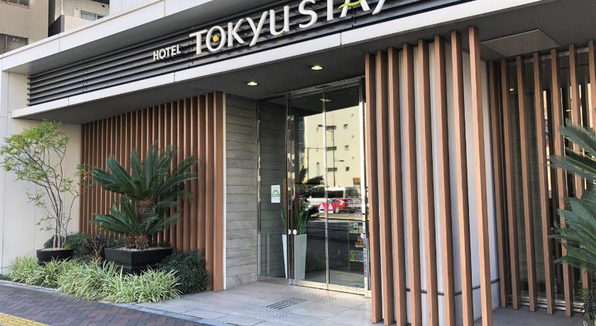 a building with a sign on the front of it, Tokyu Stay Shimbashi in Tokyo