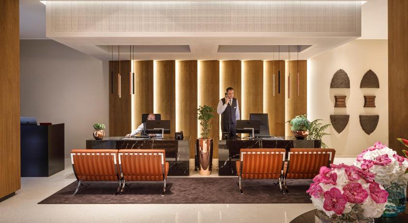 a living room filled with furniture and a large window, Hotel Ambasador - Liburnia in Opatija