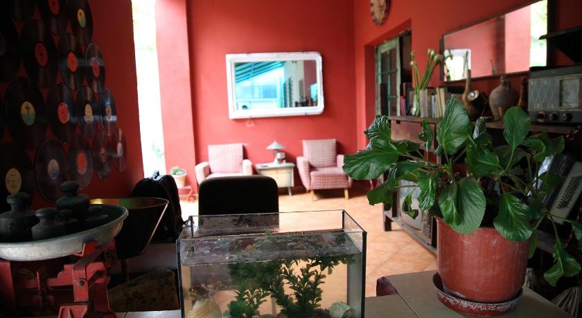 a living room filled with furniture and a tv, Trip'n'Hostel in Tirana