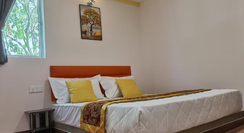 a bedroom with a large bed and a large window, Mornings Hotel in Sungai Petani