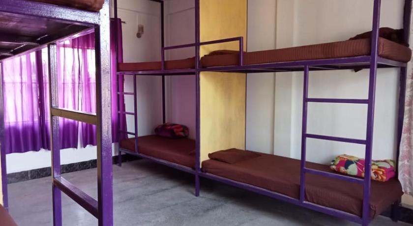 a bunk bed with two bunk beds in a room, Rani Homestay in Cherrapunji