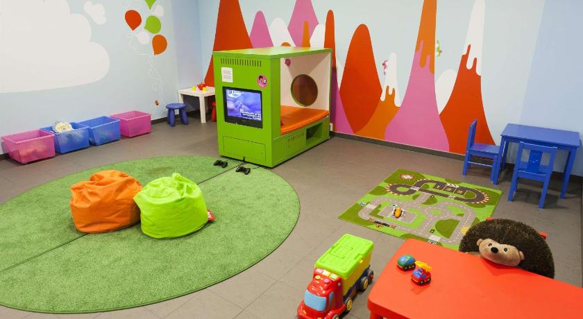 a living room filled with furniture and toys, Scandic Julia in Turku