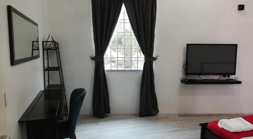 a living room filled with furniture and a window, RoomStay Hj Esmon Parit Raja UTHM in Batu Pahat