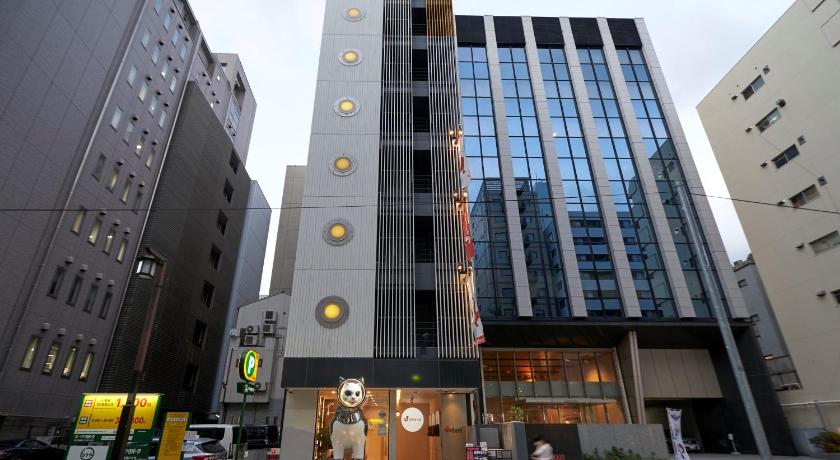a large building with a clock on the side of it, WeBase HAKATA in Fukuoka