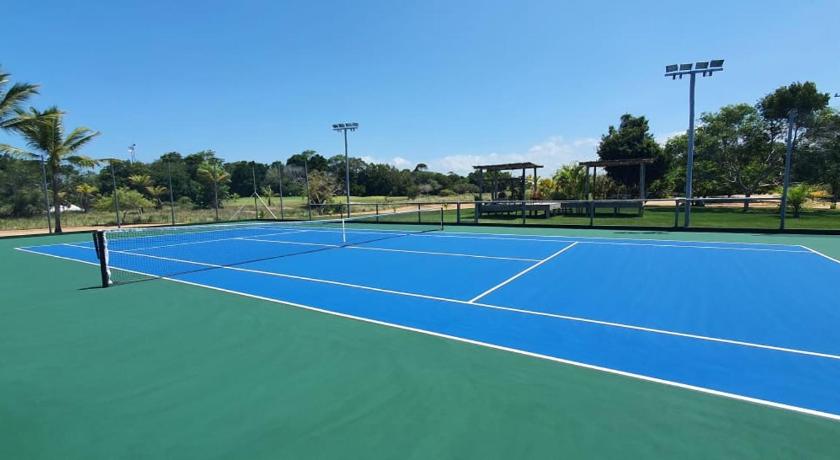 a tennis court with a tennis racquet on it, Bahia Beach House in Porto Seguro