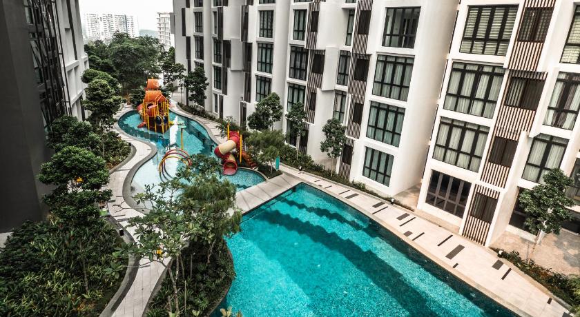 a large pool of water in front of a building, H20 Residence at Ara Damansara in Kuala Lumpur