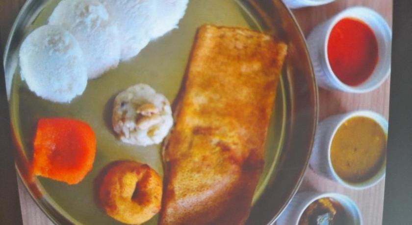 a white plate topped with breakfast foods, The Coorg Heaven in Coorg