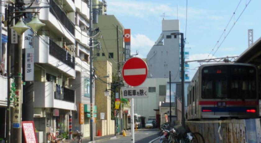 a city street with a street sign on it, SkyHeart Hotel Koiwa in Tokyo