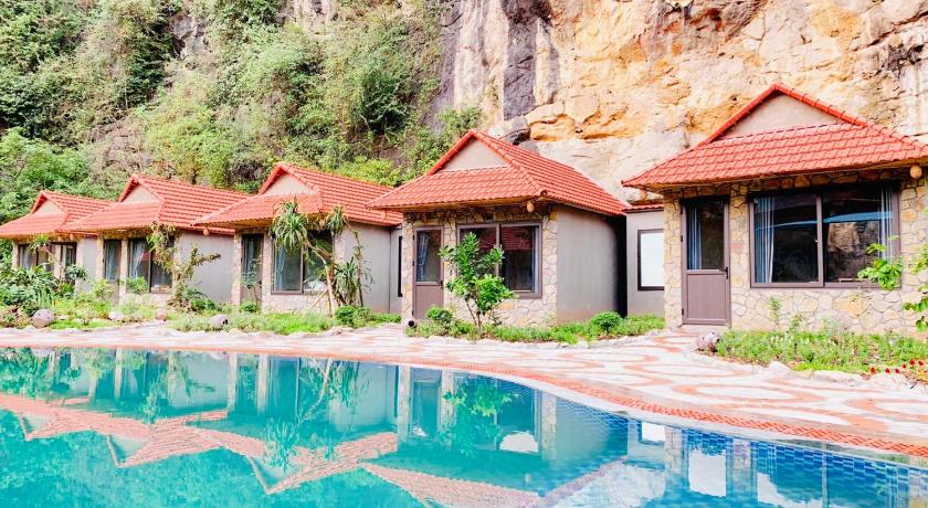 a hotel room with a pool and trees, Trang An Peaceful Homestay in Ninh Bình
